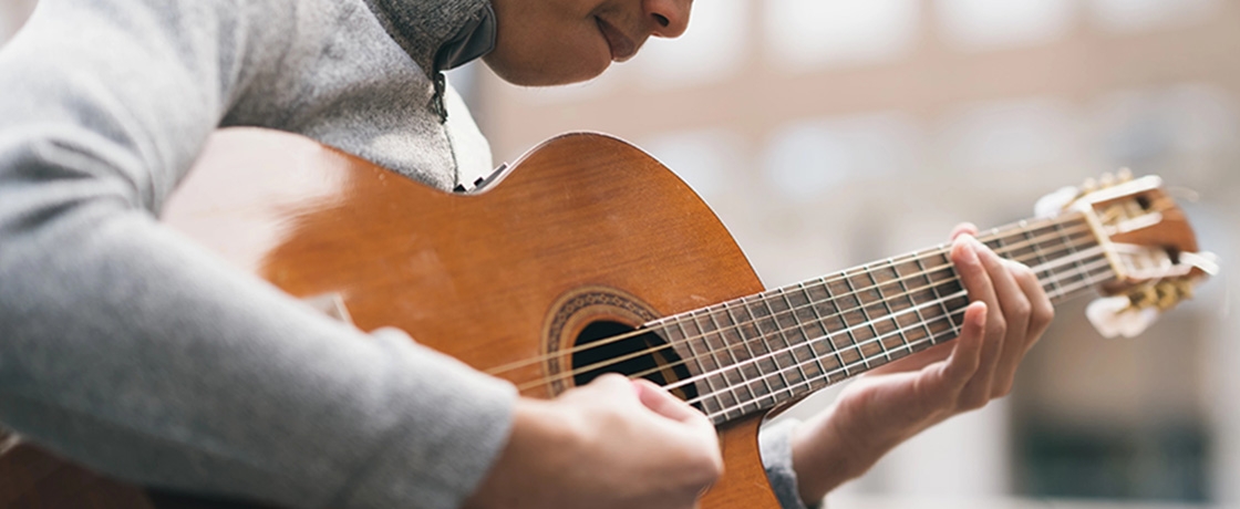 Person playing guitar