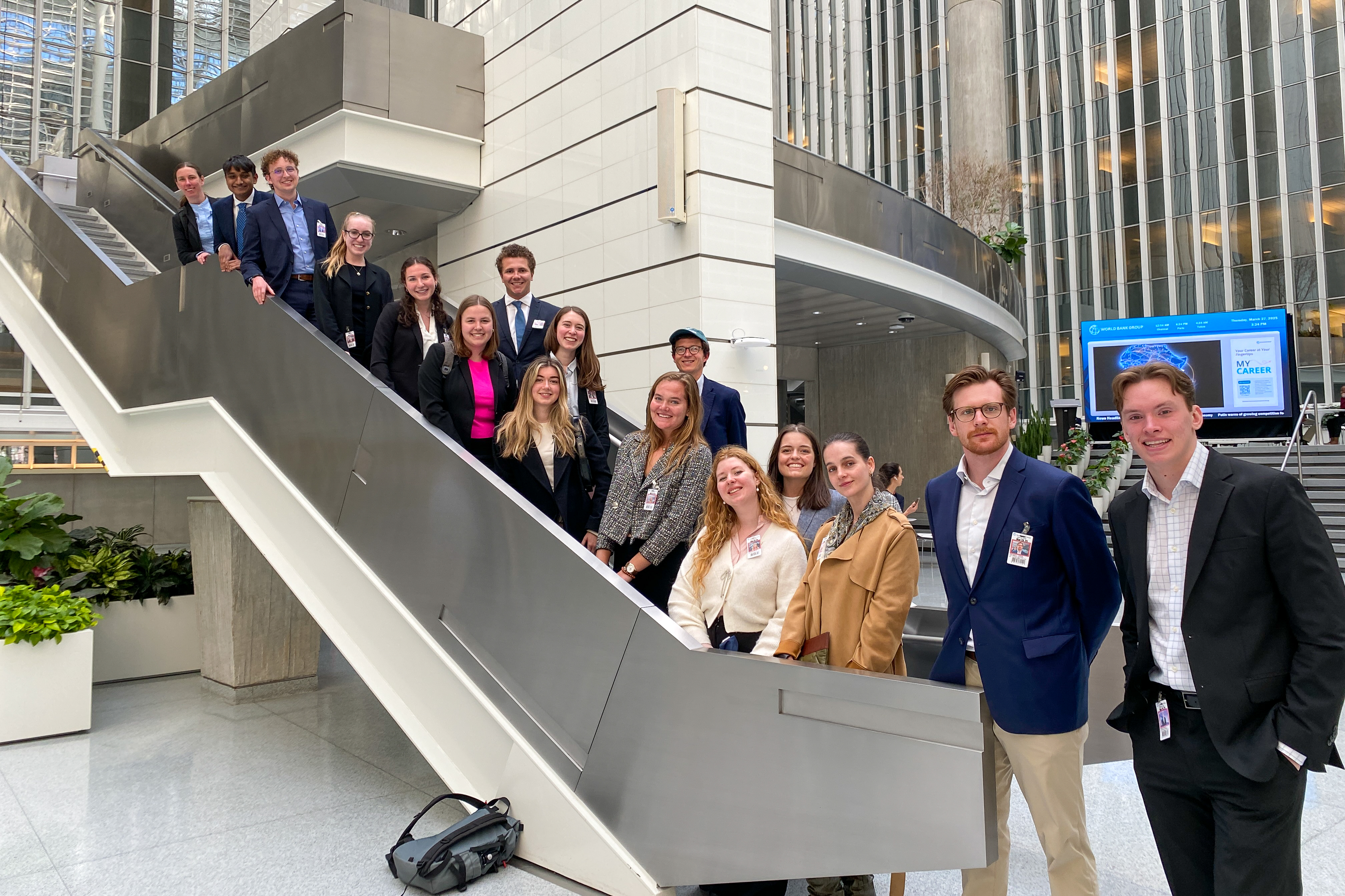 Students posing on a staircase