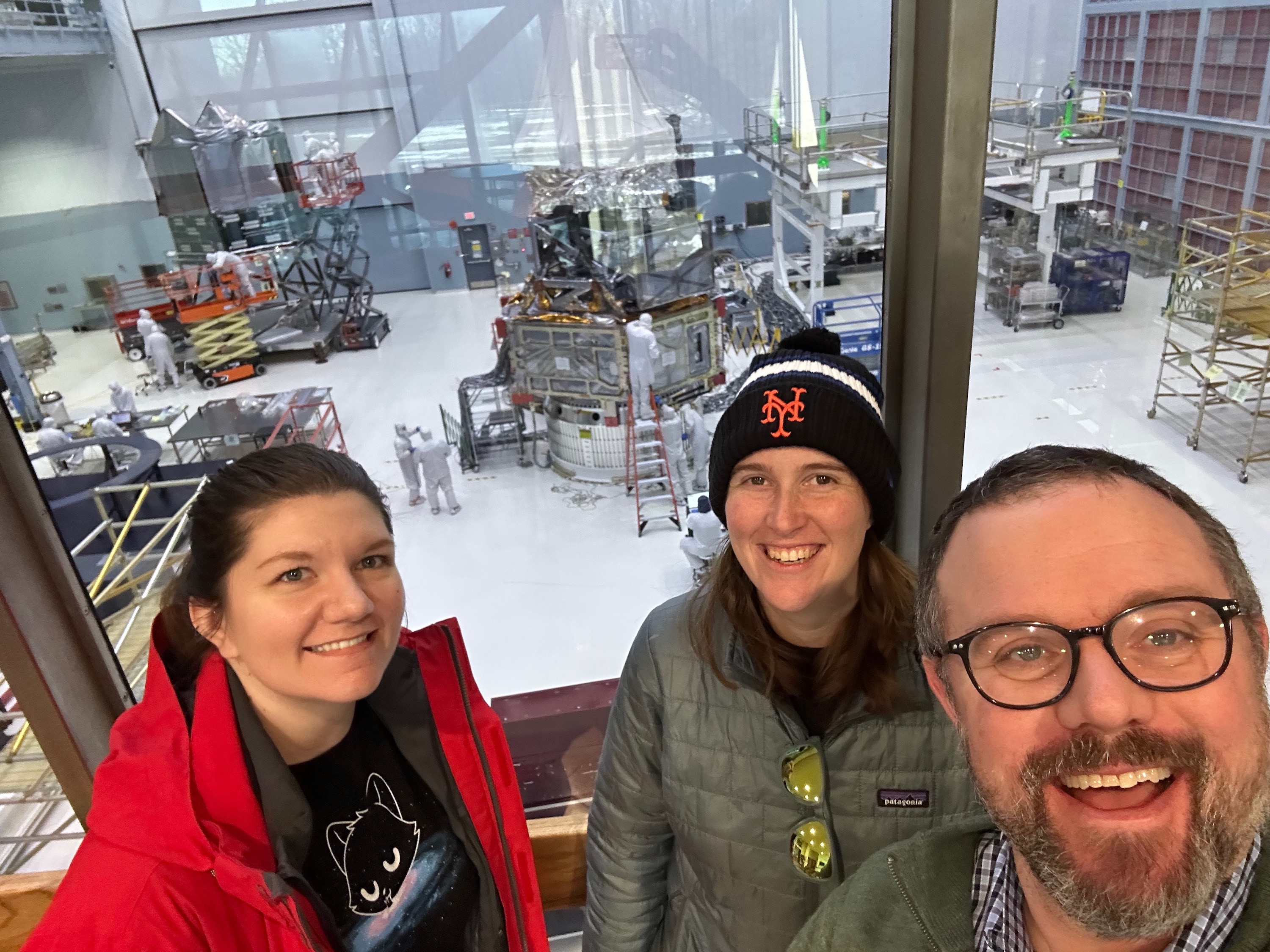 Ryan Hickox with PhD student Stephanie Podjed, left, and Kelly Whalen, Guarini ’23 (now a NASA postdoctoral program fellow) in the clean room at the Goddard Space Flight Center this past January