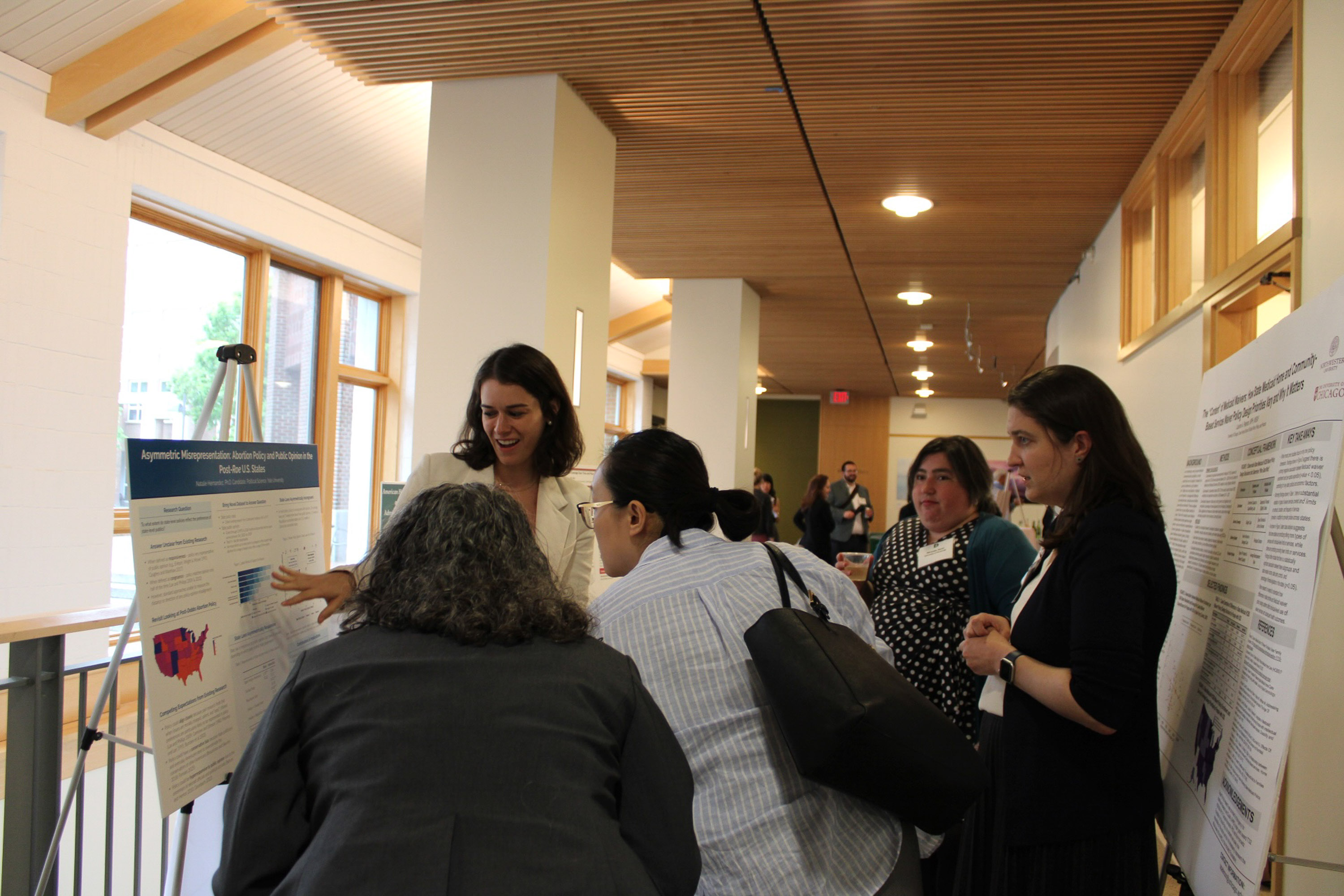 Natalie Hernandez discussing with conference attendees