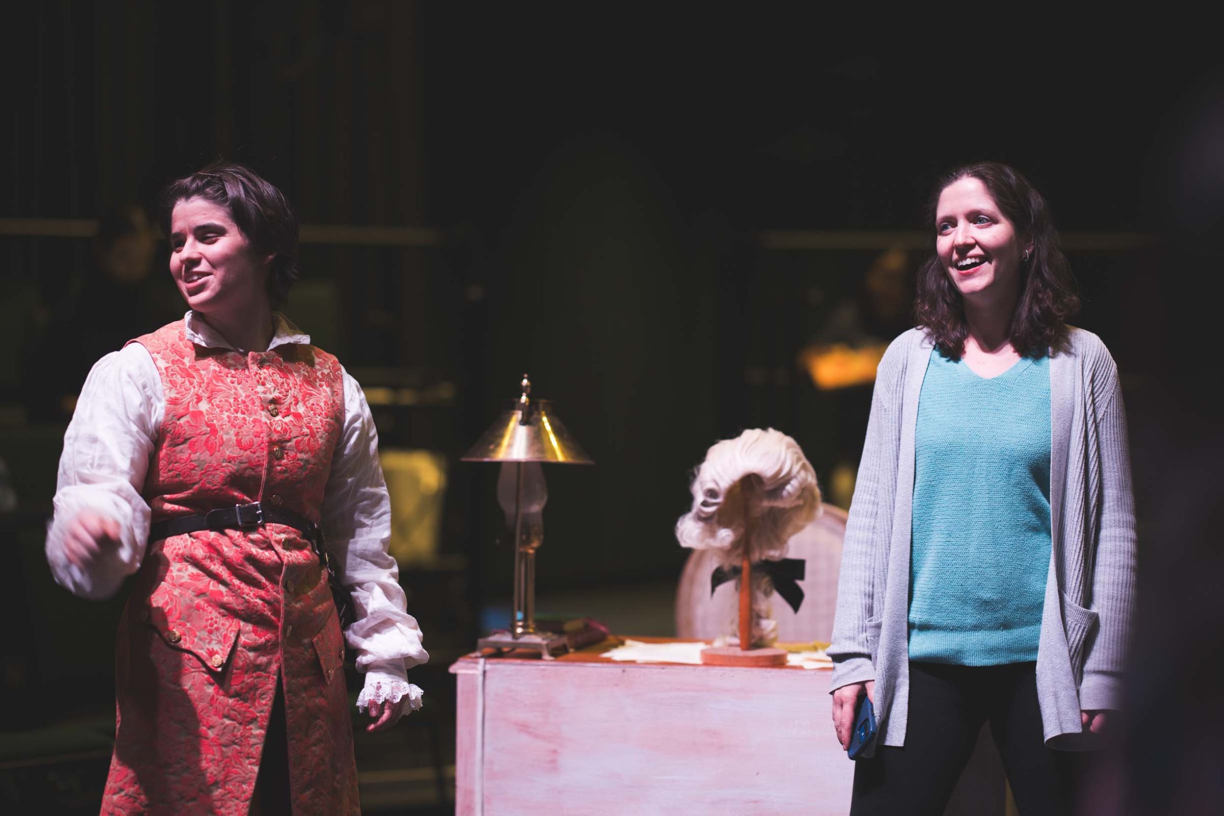 Grace Casale '26, who plays Voltaire, and director Sarah Wansley during pre-rehearsal notes.