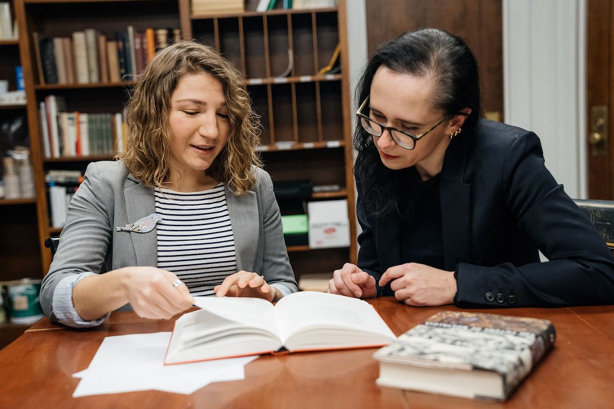 German studies professor Yuliya Komska, right, works with Tetiana Savchynska, Guarini '18, who has translated numerous English texts into Ukrainian under contract with one of the biggest Ukrainian publishers.