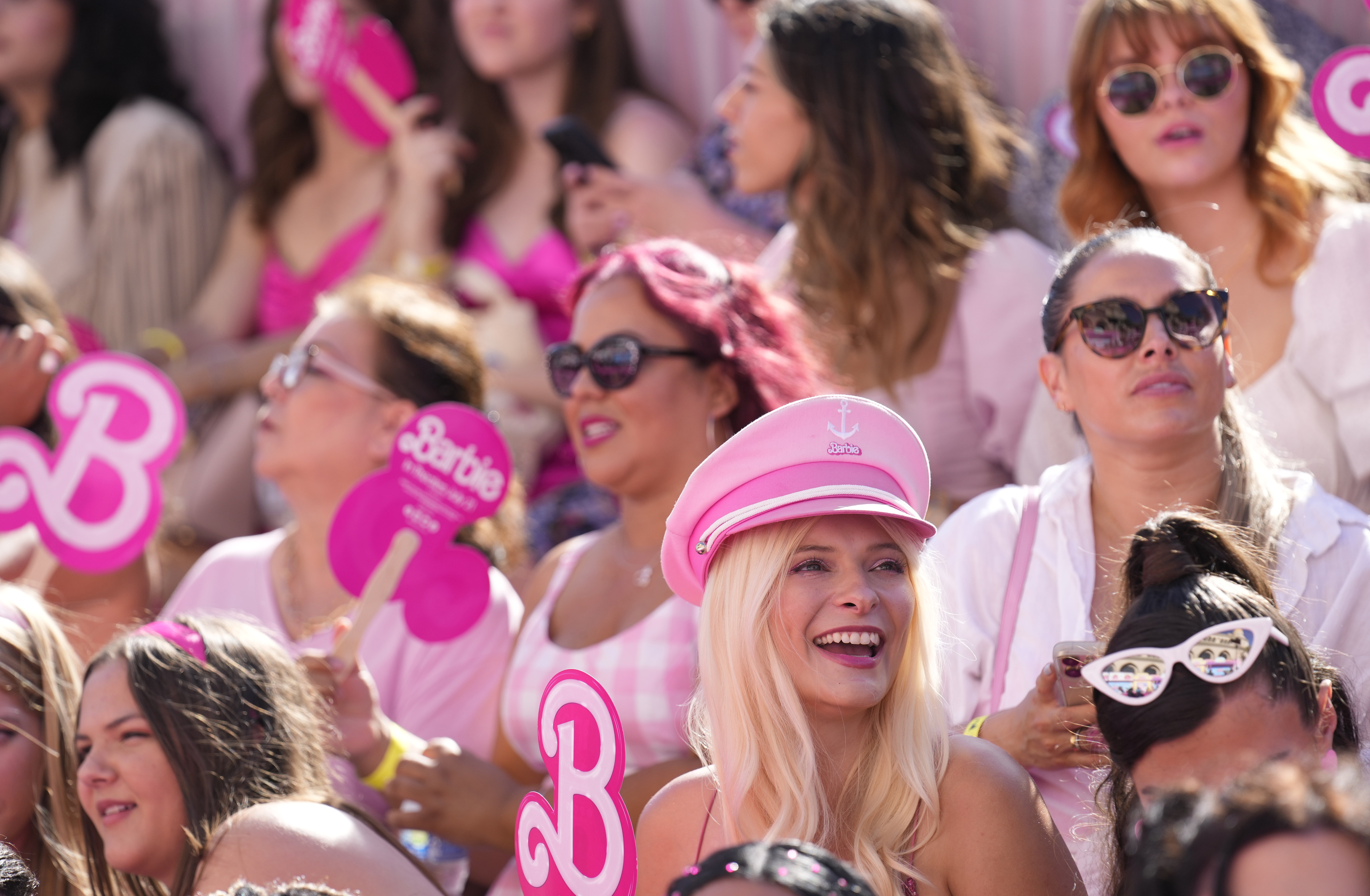 People pose in the crowd prior to the premiere of "Barbie" on Sunday, July 9, 2023, at The Shrine Auditorium in Los Angeles. (AP Photo/Chris Pizzello)