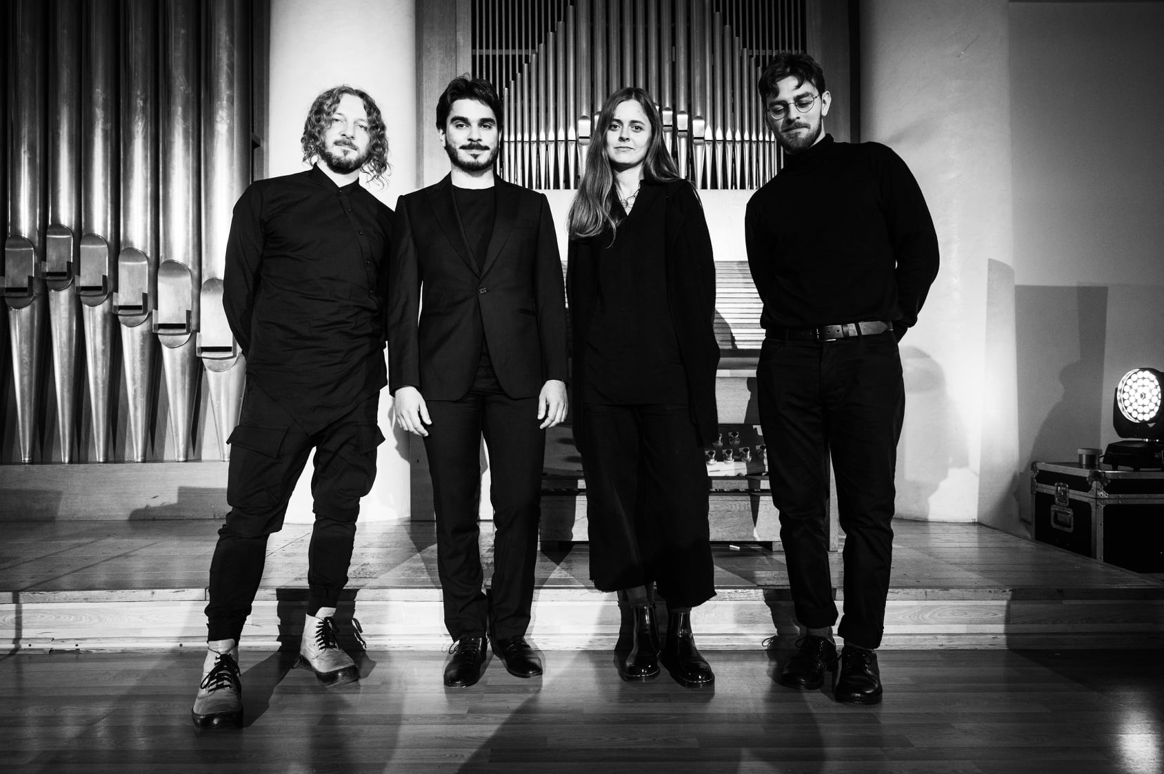 From left, Maxim Kolomiiets, Albert Saprykin, Veronika Yadukha, and Boris Loginov attend the premiere of the concert inspired by the novel Amadoka in 2021 at Ukraine's Khmelnytsky Regional Philharmonic Hall