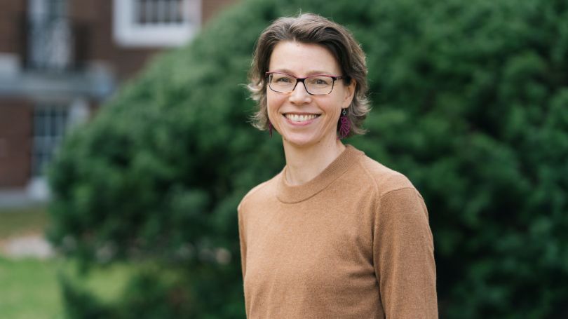 Emily Walton stands outside on Dartmouth campus