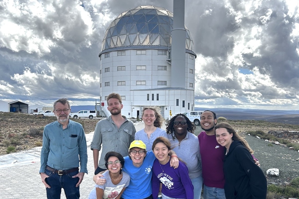 Professor John Thorstensen (left) with students in front of the South African National Observatory