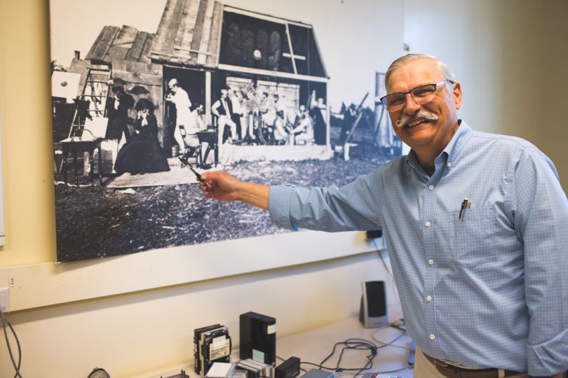 Terry Kovacs points to a print of Dartmouth's expedition to Burlington, Iowa in 1869 Terry Kovacs points to a print of Dartmouth's expedition to Burlington, Iowa in 1869