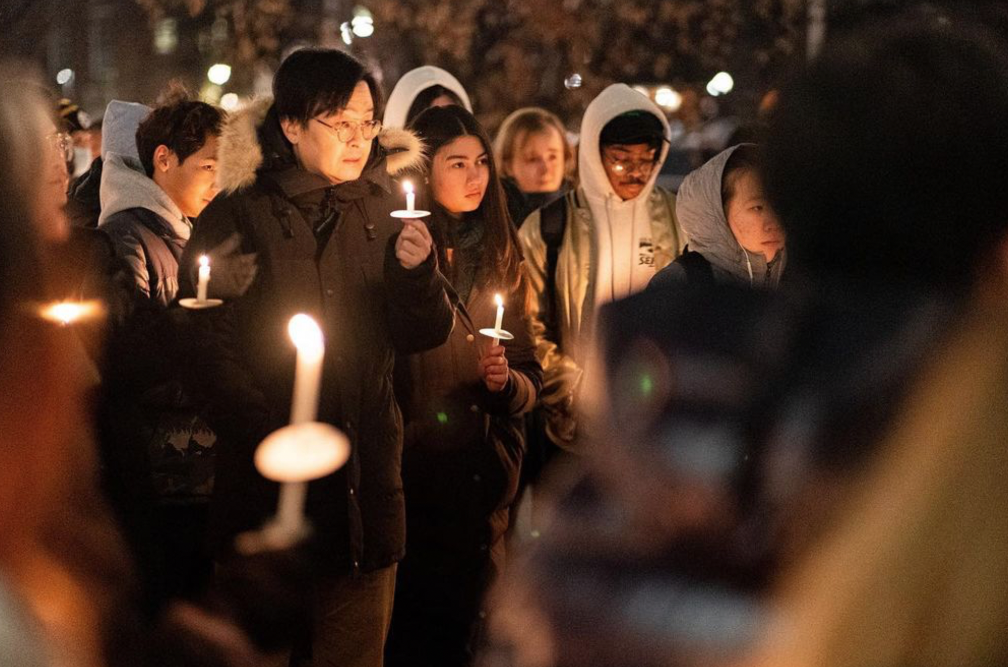 Sunmin Kim with students at vigil