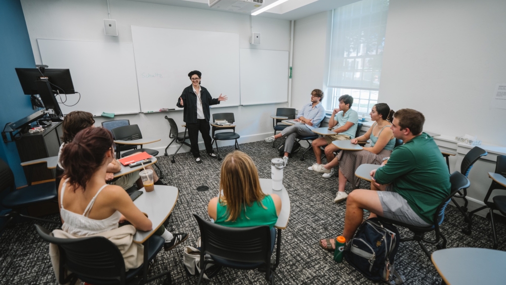 Teacher speaking to a group of students