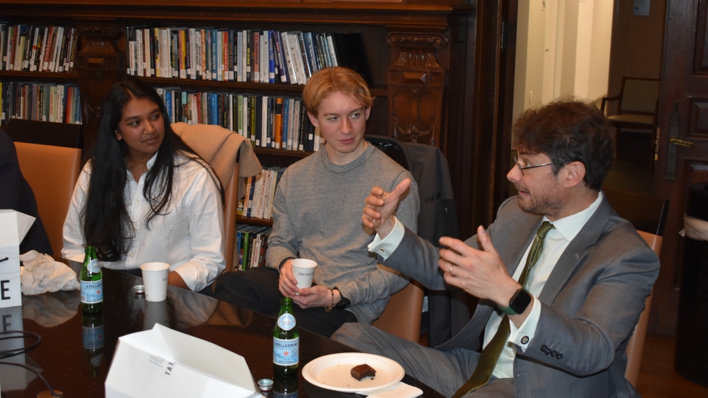 Francina Kolluri and Nicholas Booth talking with Aaron Klein