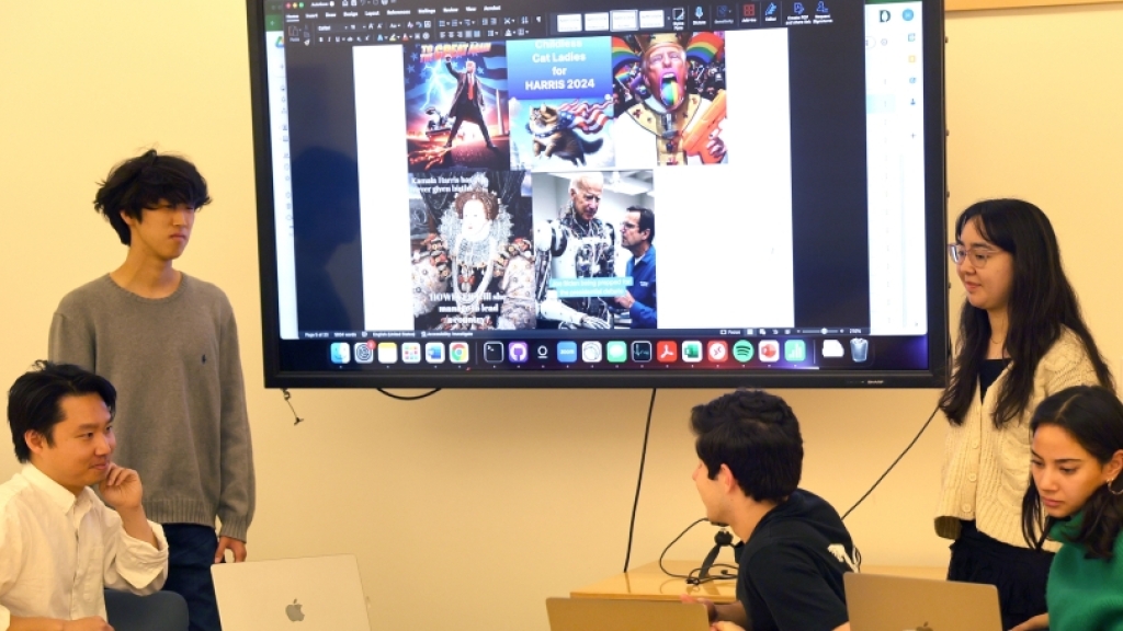 Professor Herbert Chang ’18 (left) and students discuss election-related memes and AI-generated images