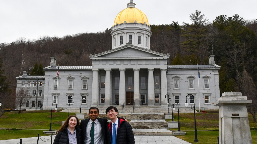 Erin Parker, Pranav Akella, and Alan Cui outside the Vermont Statehouse