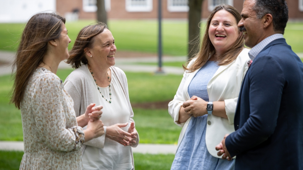 Faculty laughing together