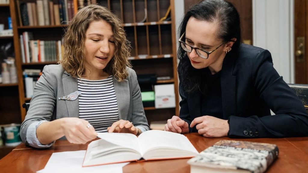 German studies professor Yuliya Komska, right, works with Tetiana Savchynska, Guarini '18, who has translated numerous English texts into Ukrainian under contract with one of the biggest Ukrainian publishers.