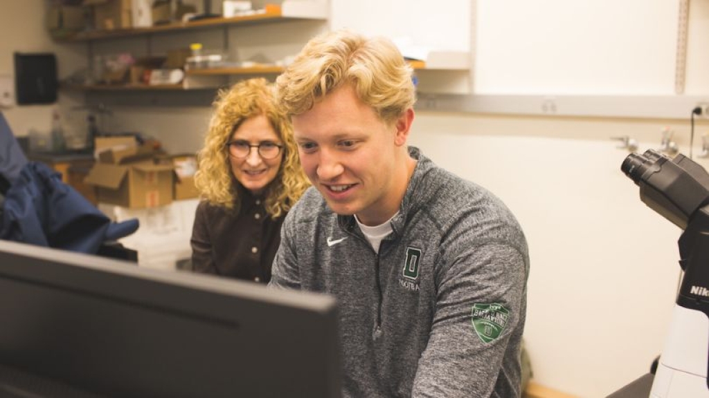Ann Lavanway teaches Cameron Baller '23 how to work with the new Nikon SoRa microscope